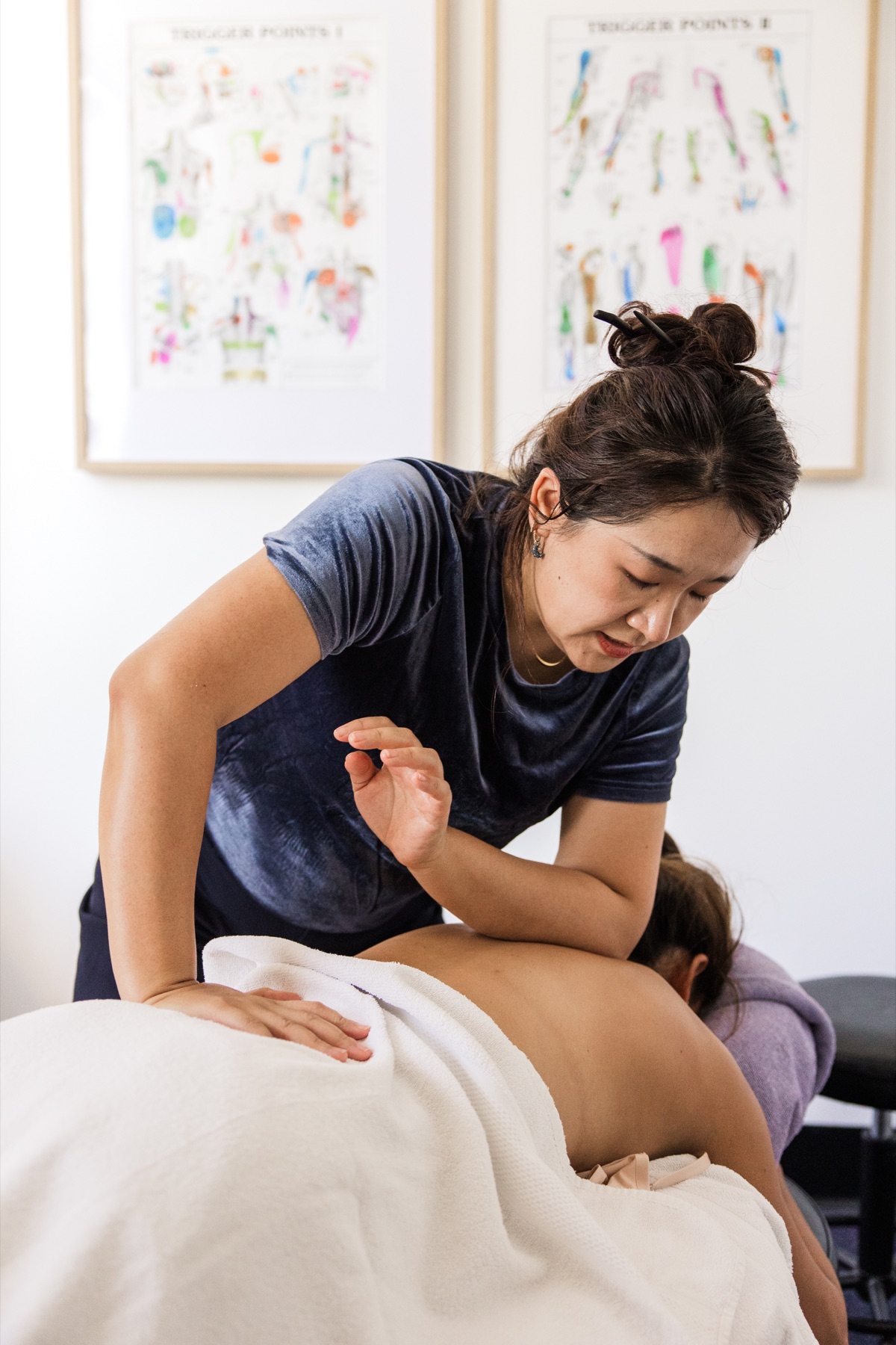 Sienna providing a massage treatment